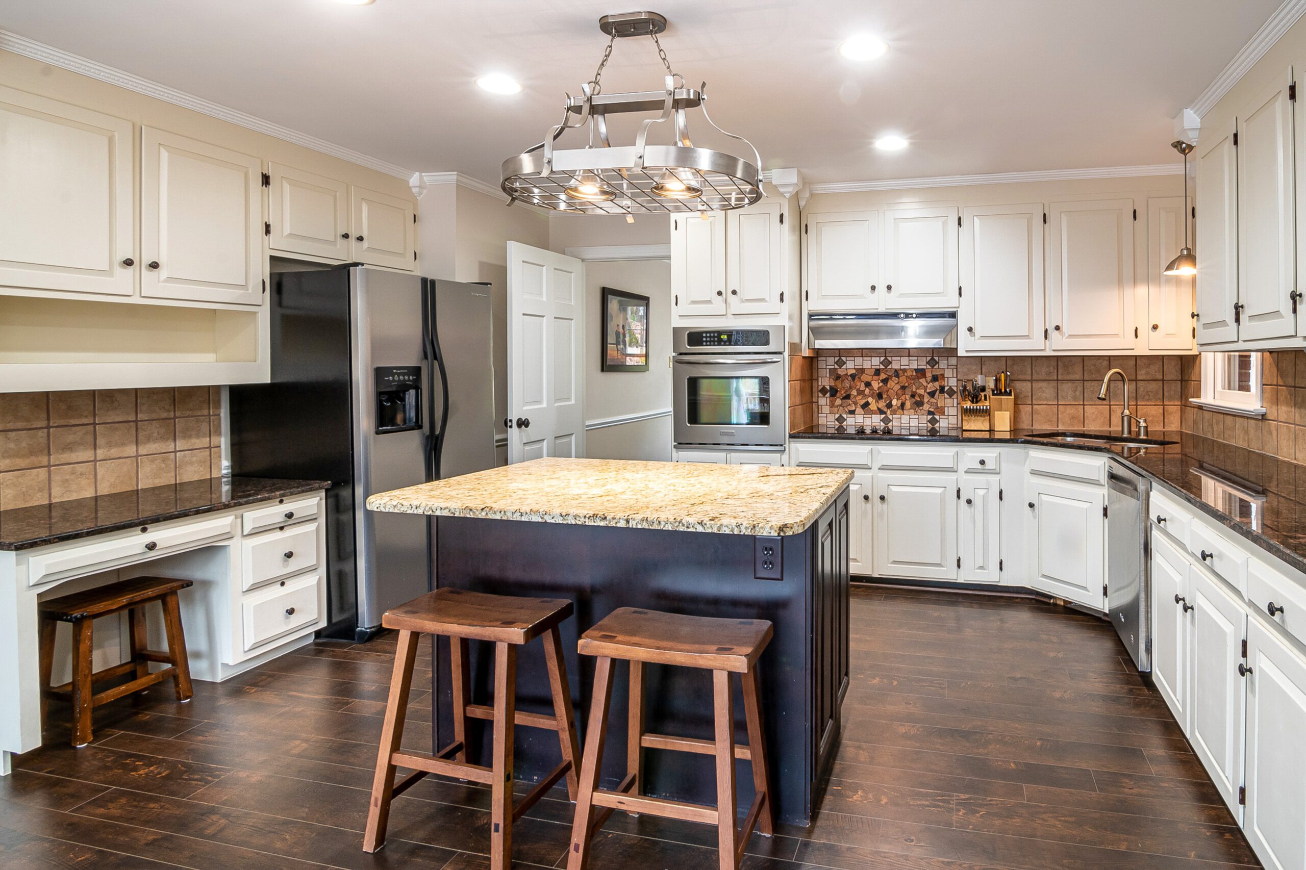 the kitchen is very modern with dark wood cabinetry, in the style of pastoral charm, 1980s, wooden floors