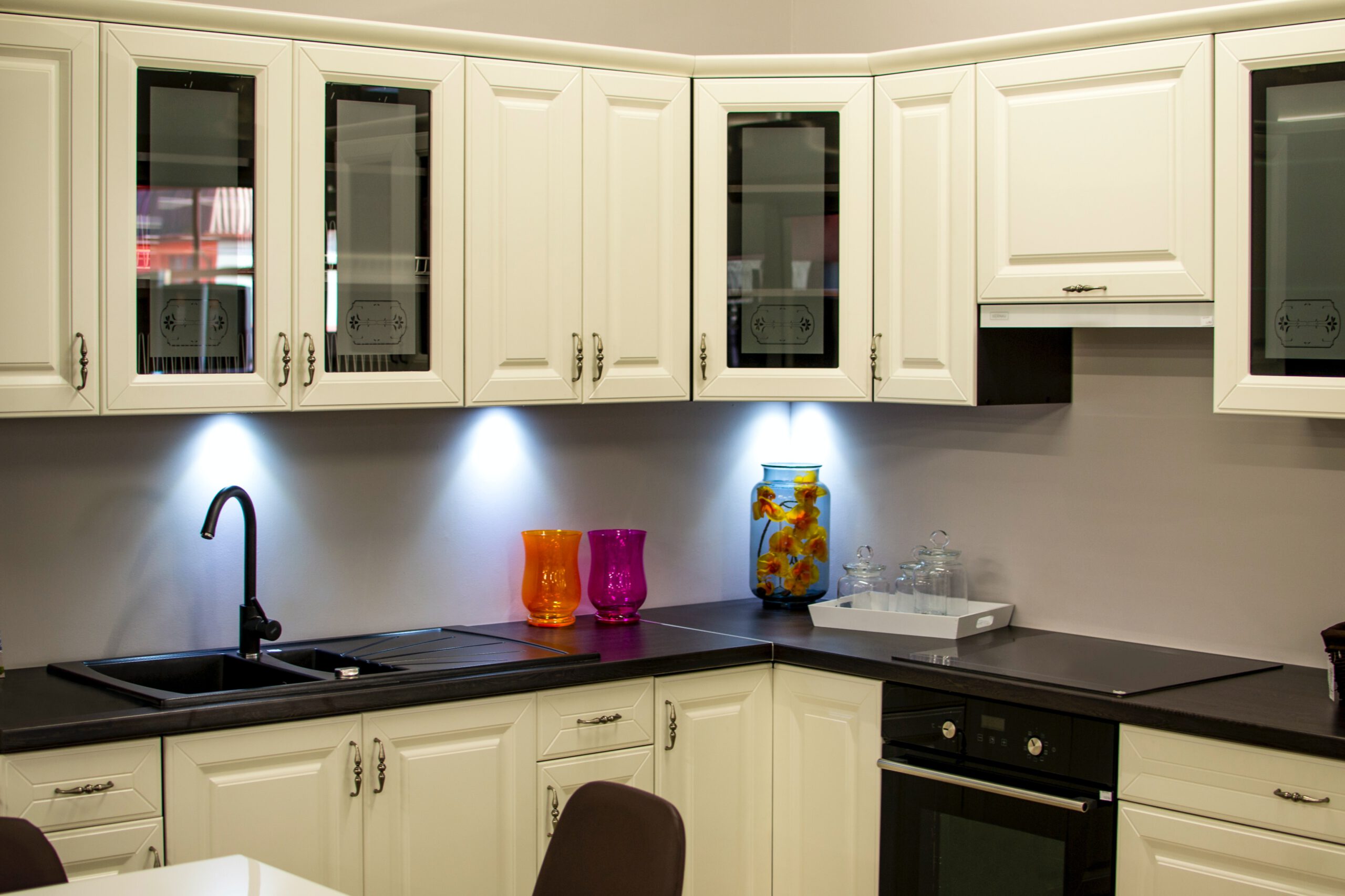 black countertops and white/cream cabinets on the cabinets