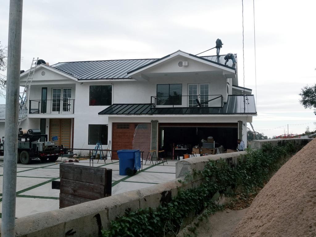 white and black house made with a metal roof, in the style of sea and coast painter, precisionist lines, precisionist lines, ren hang, realistic, realistic, concrete